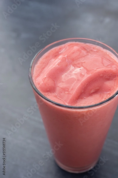 Fototapeta A view of a cold strawberry smoothie.
