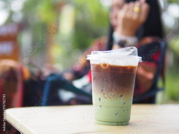 Obraz Iced coffee mixed with orange juice, two tones layer decoration.