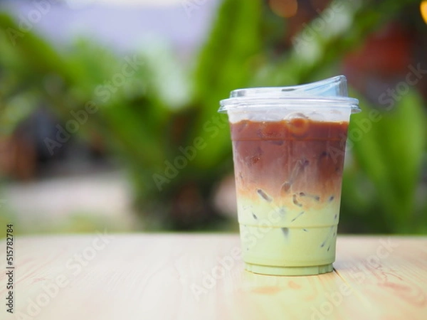 Obraz Iced coffee mixed with orange juice, two tones layer decoration.