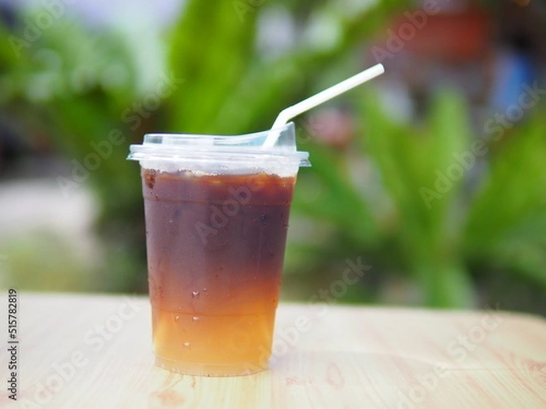 Obraz Iced coffee mixed with orange juice, two tones layer decoration.