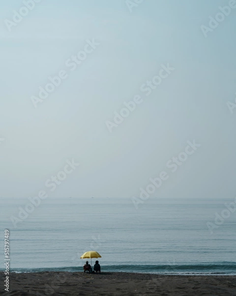 Obraz パラソルの下でくつろぐ人達