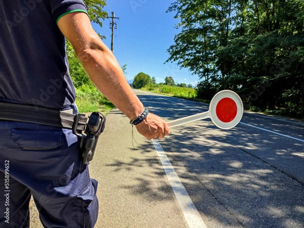 Obraz Policeman with a paddle close-up