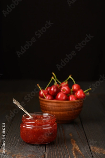 Fototapeta Homemade cherry jam on a rustic background