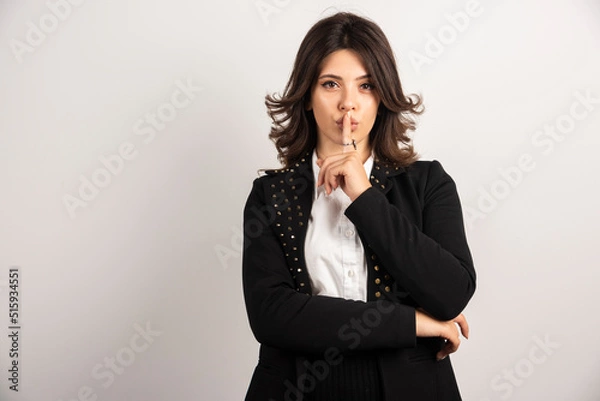 Obraz Confident employee making slient gesture