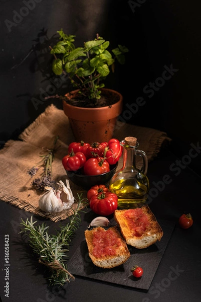 Fototapeta Traditional Spanish appetiser - "Pan Tomaca" (bread with tomato) toasted bread with garlic topped with freshly squeezed tomato and virgin olive oil.