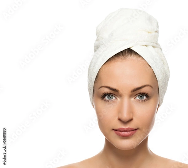 Fototapeta beautiful woman with a towel on his head on a white background