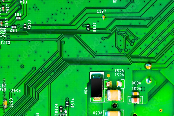 Fototapeta Close up of components and microchips on PC circuit board.