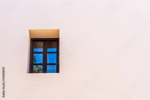 Fototapeta Small window on orange wall. 