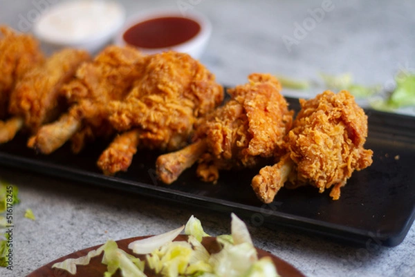 Fototapeta Chicken Lollipop Grilled Tandoor Tandoori Non Veg With Schezwan Dip Chutney On Side selective focus.