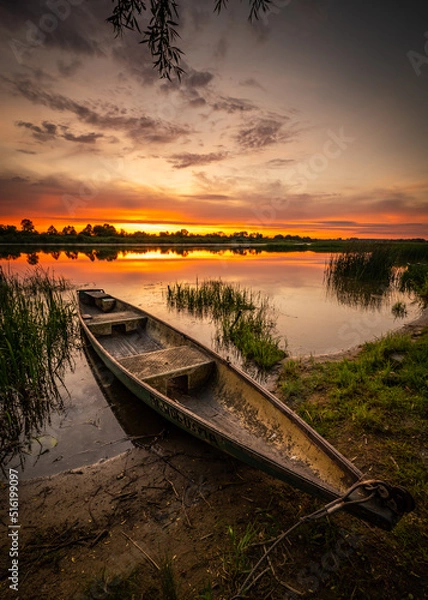 Fototapeta colorful and delightful sunset over the bug river