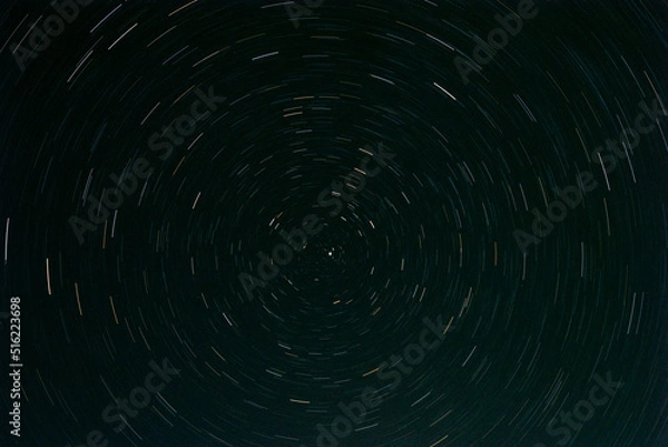 Fototapeta Polaris shot. Stars are moving in the circle.
