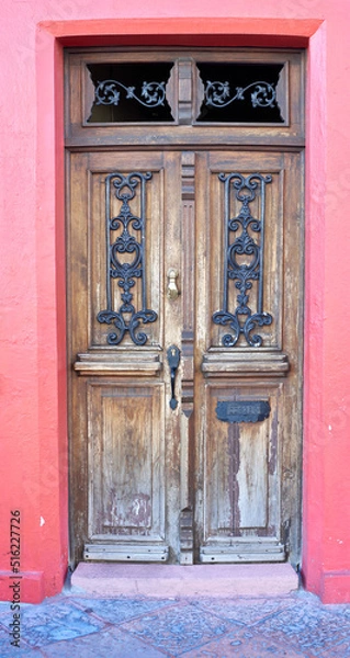 Obraz Old door with iron knocker