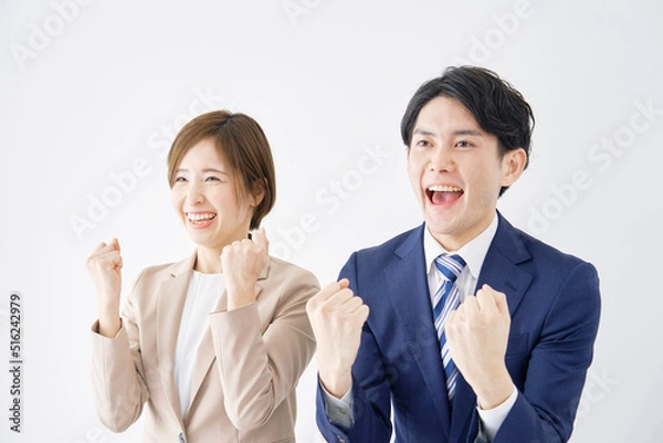 Fototapeta ガッツポーズをするビジネスウーマンとビジネスマン　白背景