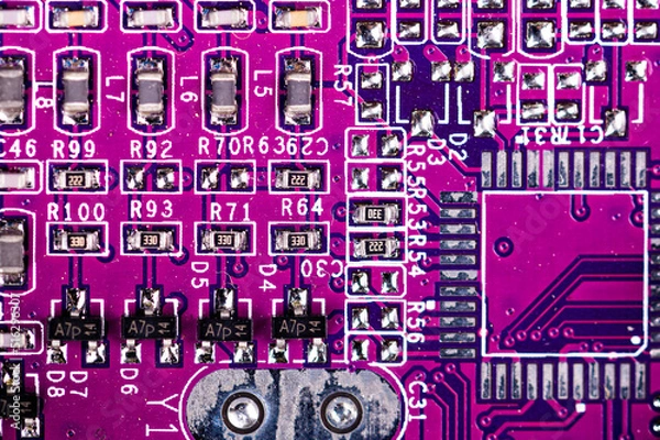 Obraz macro closeup shot of microchip on red printed circuit board, computer motherboard with components