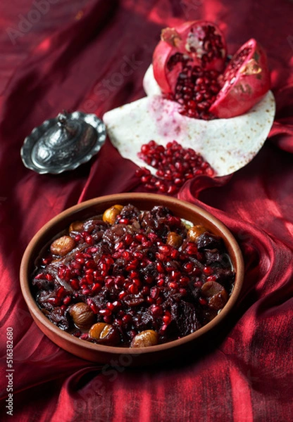 Fototapeta Azerbaijani national dish meat with chestnuts and pomegranate onions from the chef 