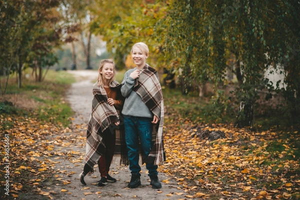 Fototapeta couple walking in autumn park
