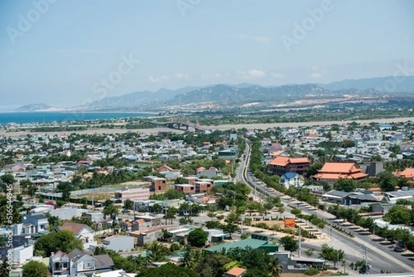Fototapeta Landscape photo: panoramic view of Phan Rang coastal city from above.Time: June 20, 2022. Location: Phan Rang City.  