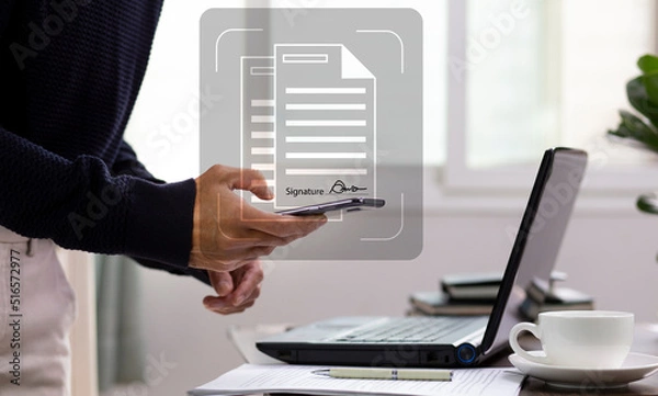 Fototapeta person using smartphone with ducument electronic signature at workplace, Electronic Signature concept 
