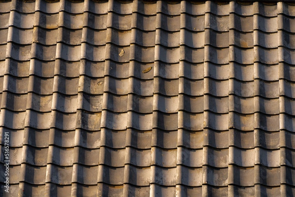 Obraz 夕陽に染まる屋根瓦の背景素材