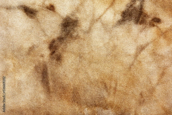 Fototapeta Old fabric with brown stains full frame for background, murder case idea, old blood stains on fabric,cream brown abstract