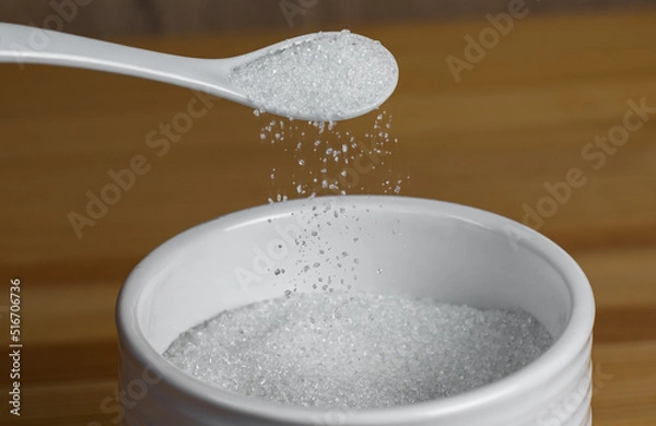 Obraz Kitchen set is sugar with a spoon on a wooden table