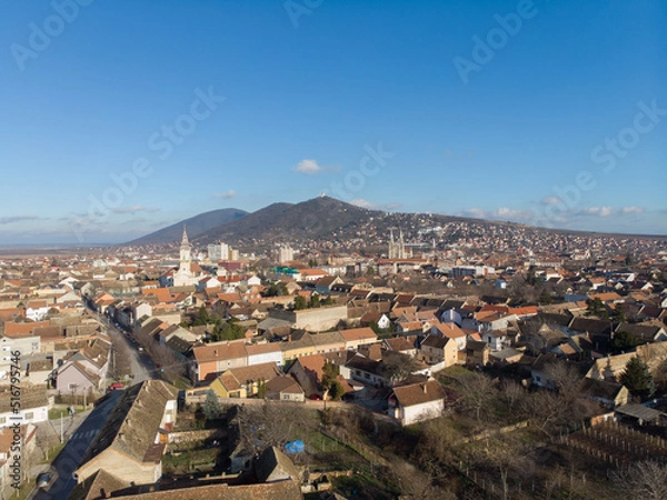 Fototapeta The town of Vrsac and the hills behind. Aerial photo.
