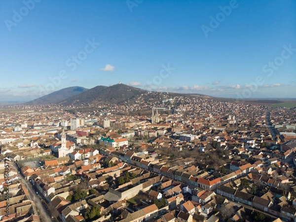 Fototapeta The town of Vrsac and the hills behind. Aerial photo.
