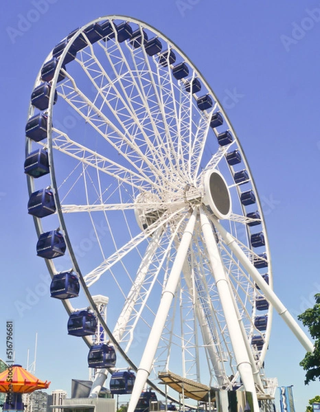 Fototapeta Chicago, Illinois - June 18,2022 : Beautiful Blue Sunny Day at Centennial Wheel in Navy Pier