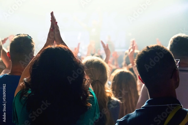 Fototapeta The audience applauded by the stage artist. They shines the spotlight.