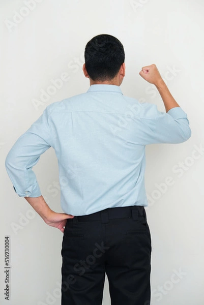 Fototapeta Back view of manager clenched fist to express excitement