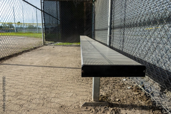 Fototapeta Angled view of the dugout on a baseball field, without any people around