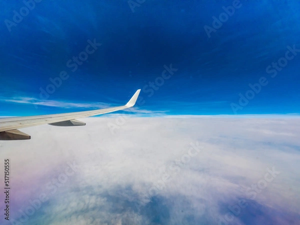 Fototapeta View from an airplane window onto clouds