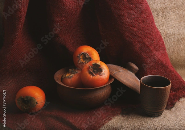 Fototapeta still life with persimmons and earthenware