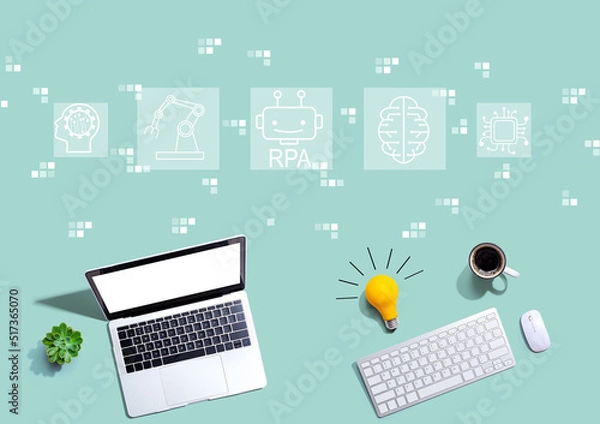 Fototapeta Robotic Process Automation theme with computers with a light bulb
