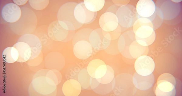 Fototapeta Abstract multicolored soft bokeh circles background. Christmas holiday concept orange, yellow colored glowing magic light bokehs. 