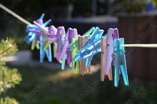 Fototapeta Clothespins outside on the clothesline