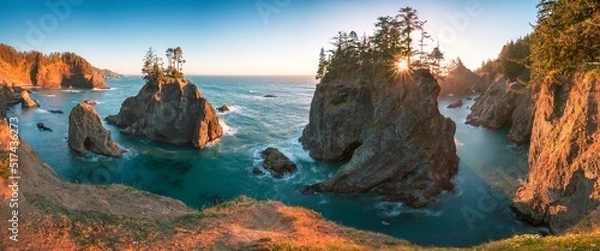 Fototapeta Sunset at Natural Bridges along Samuel H. Boardman State Scenic Corridor, Oregon during a golden hour sunset - sunbeams through trees with dense vegetation.
Beautiful seascape with rocks. West Coast 