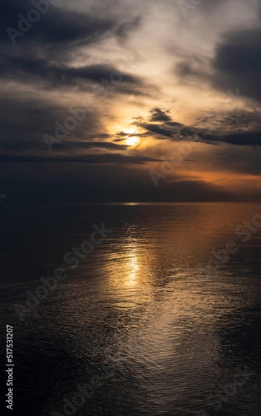 Obraz Gorgeous, dramatic sunset over water