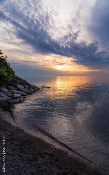 Obraz Gorgeous, dramatic sunset over water