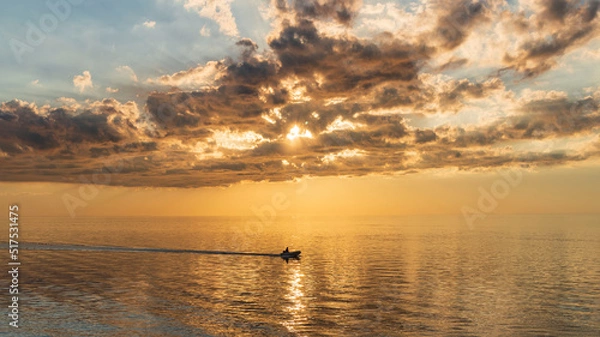 Obraz Gorgeous, dramatic sunset over water