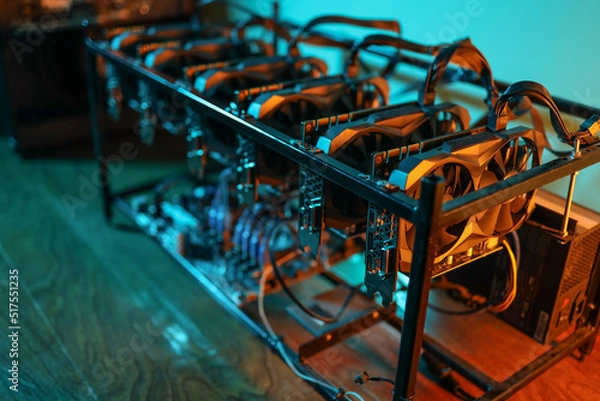 Fototapeta Cryptocurrency mining rig with computer graphics