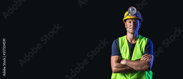 Fototapeta Miner man on black background with space for text