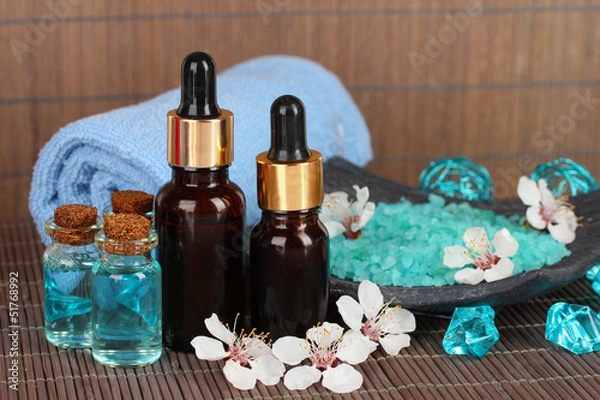 Fototapeta Spa composition with aroma oils on table close-up