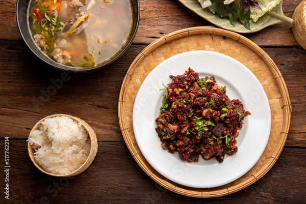 Fototapeta Laab Thaifood menu, raw food. laab moo mee of  the North Lanna Thai food style, on table background. thaifood concept. 