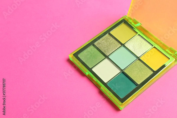 Fototapeta Colorful eyeshadow palette on pink background. Space for text