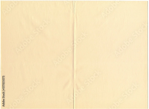 Fototapeta Highly detailed large image of an old, thin, weathered, yellowed, beige uncoated sketch paper texture background scan folded in half fine grain fiber pattern, soft crease for high resolution wallpaper