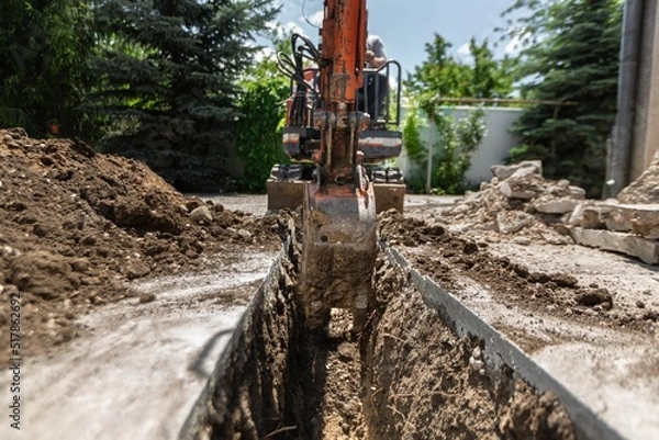 Fototapeta Driver working on an tractor or earthmoving machine