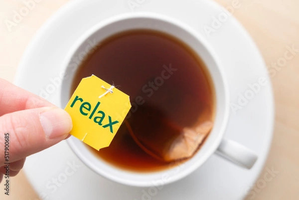 Fototapeta Top down view of cup of tea with the word 'relax'