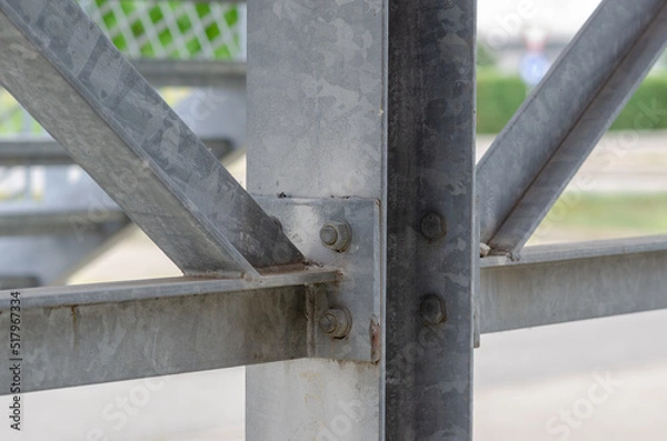 Fototapeta beam architecture: detail of a structure built with steel beams joined with bolting to support a staircase for emergency exits in a public building.