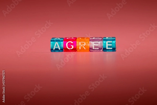 Fototapeta the word "agree" made up of cubes